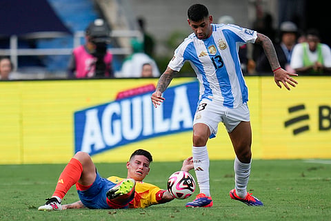2026 FIFA World Cup Qualifying, Colombia vs Argentina: Argentina's Cristian Romero, right, and Colombia's James Rodriguez battle for the ball